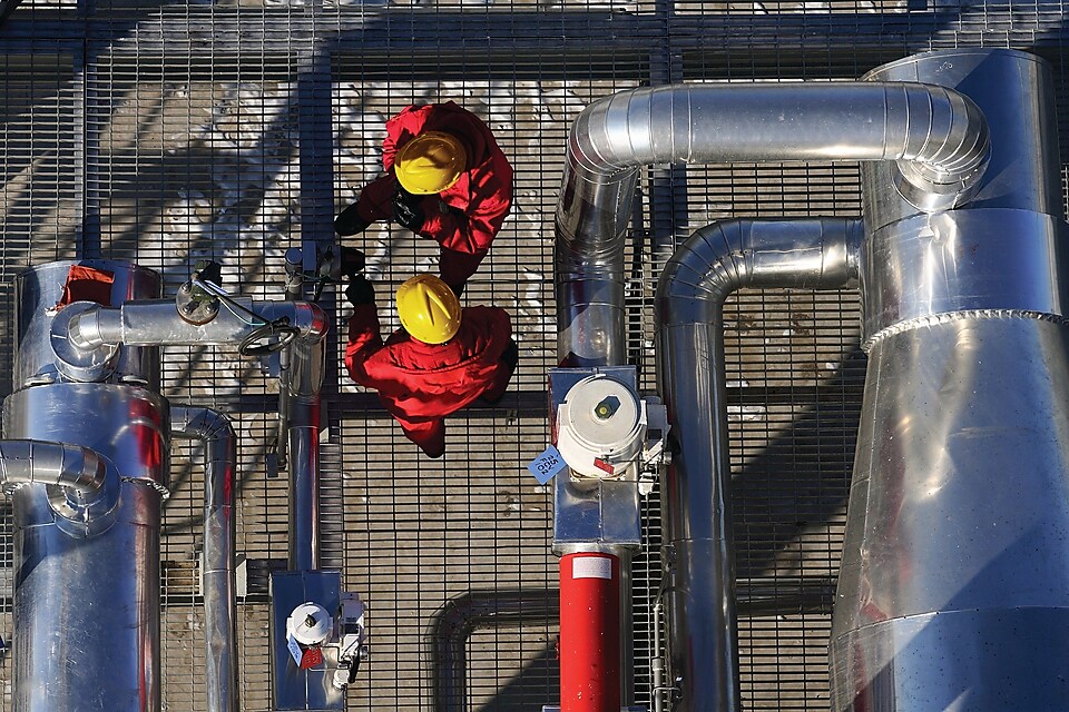 two shell employees working at processing facility