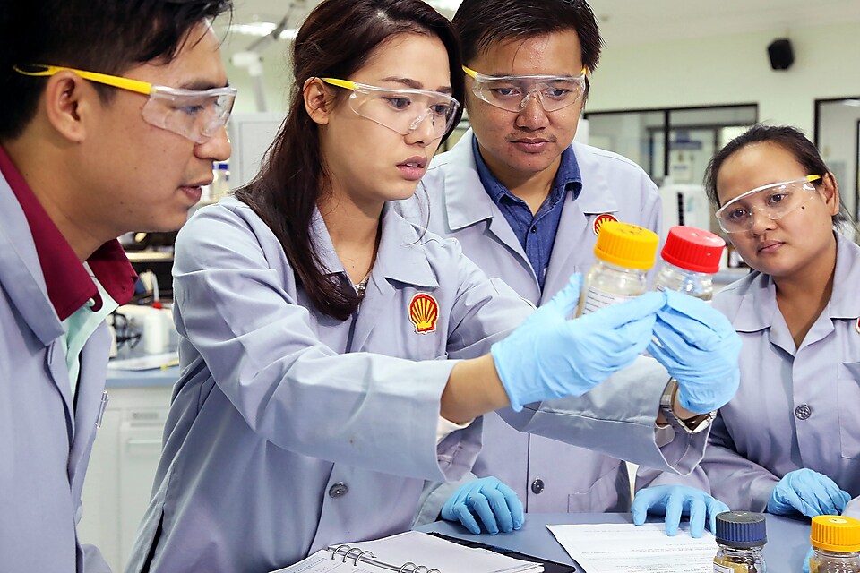 Hydrocracking scientist monitors the temperature that turns wax into oil