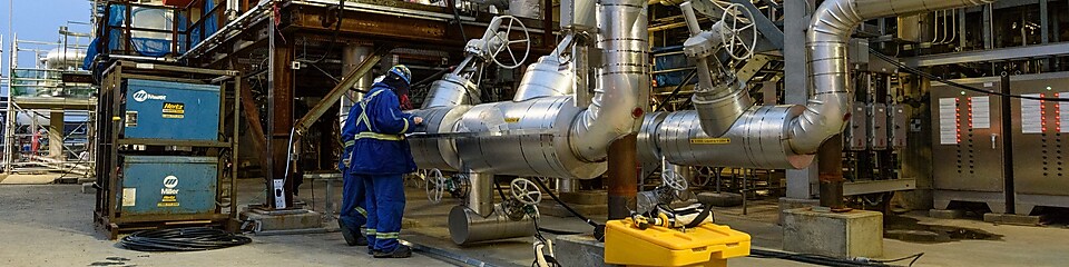 workers at refinery plant