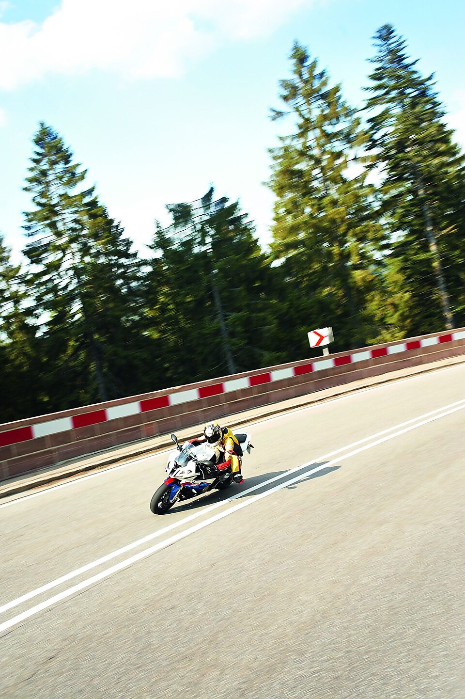 Motorbike racing around a track corner