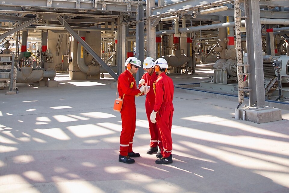 three workers having a discussion
